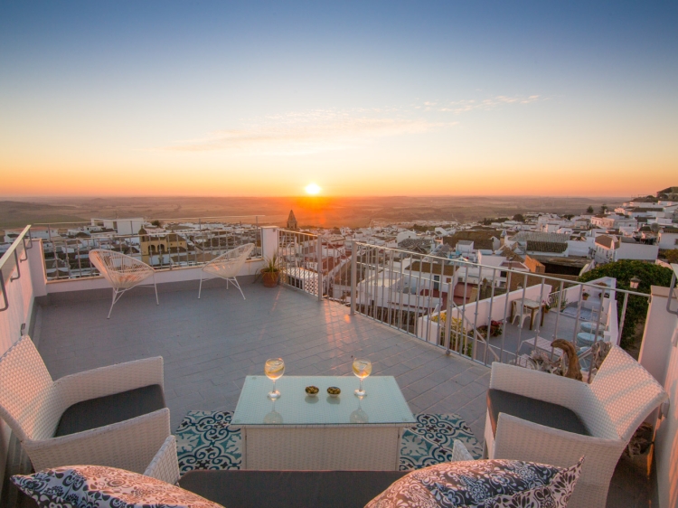 Sun sets over the Bay of Cadiz from the roof terrace of Casa La Muralla 