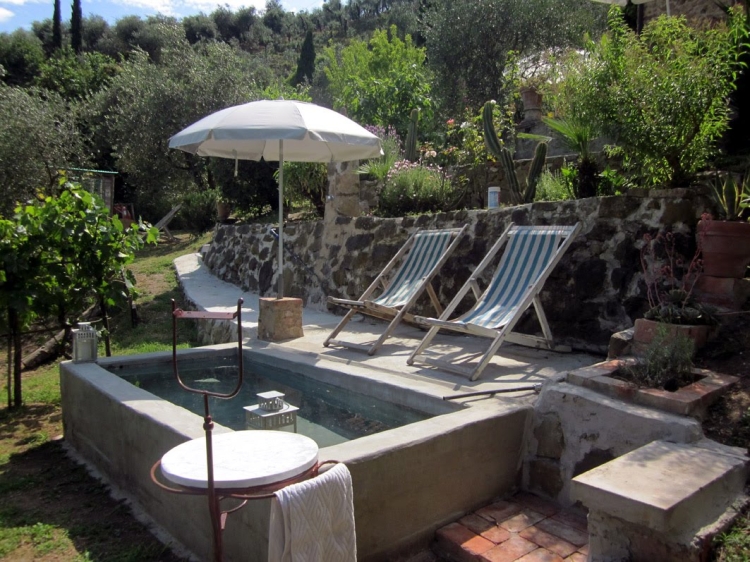 large bathtub on the terrace in front of the house