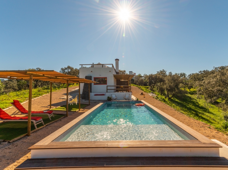 Outside relax area with view to the pool and nature