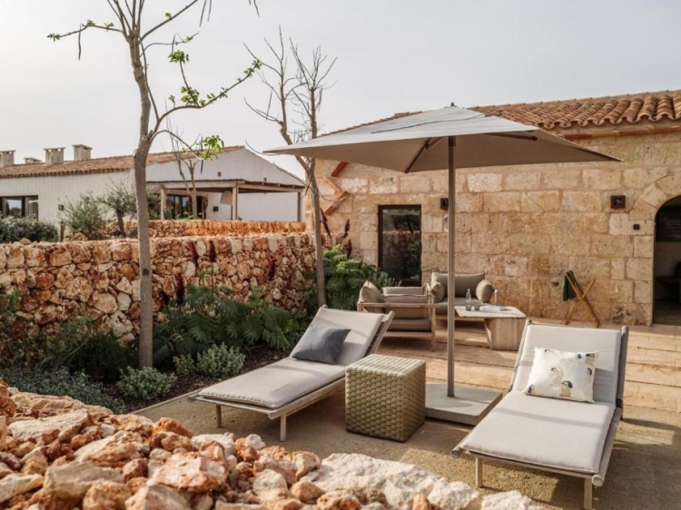 Comfortable sunbeds at the exclusive and luxurious Vestige Son Vell in Menorca, Balearic Islands.     