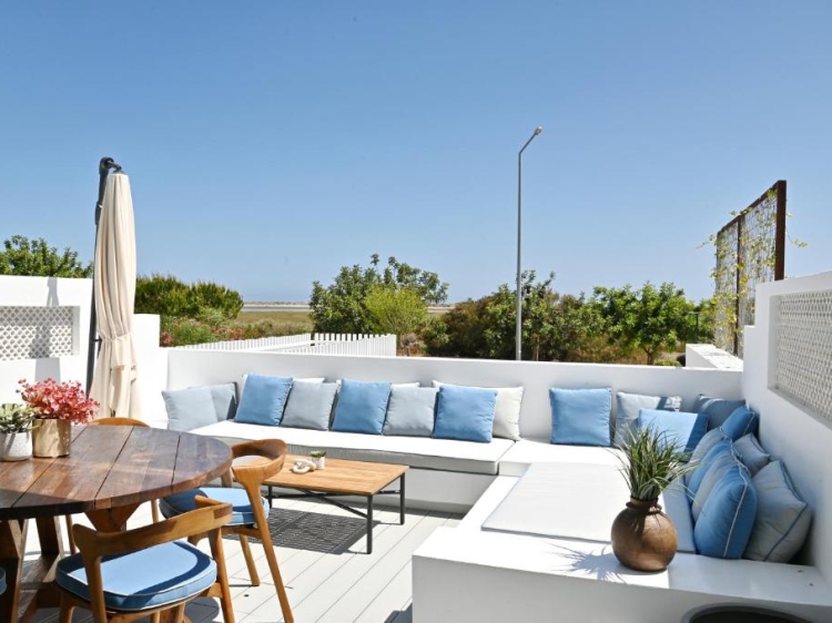 Balcony with sofa and views to Ria Formosa. Exclusive and luxury. Salt Houses in Fuseta, Algarve, Portugal. Holidays. Large house with swimming pool.