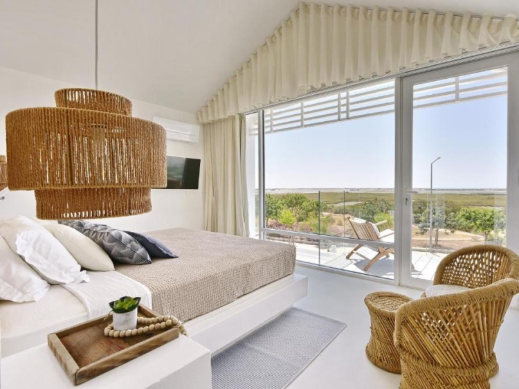 Cosy suite with balcony and nature views in Casas de Sal in Fuseta, Algarve, Portugal. Family holiday. Large house with pool. Ria Formosa.