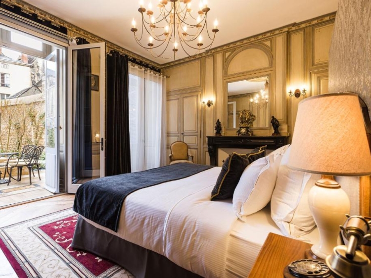 Room of the exclusive hotel Le Petit Manoir in Sarlat-la-Canéda in France. Charming hotel with swimming pool. Elegant and cosy.  