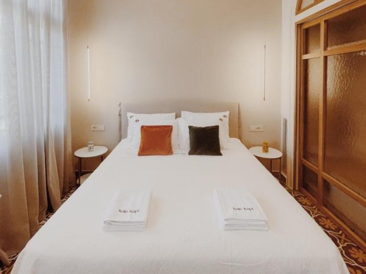 Double bed, Pillows, Side tables, Pendant lights, Modern design