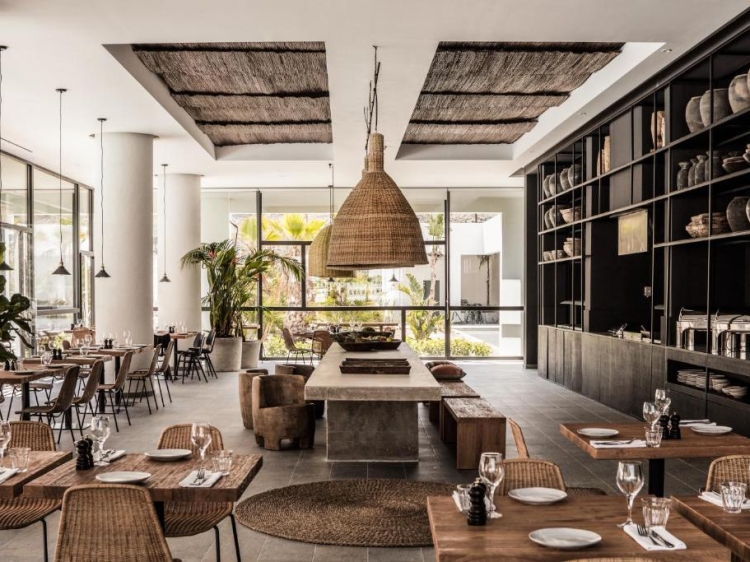 modern dining area with stone and wood