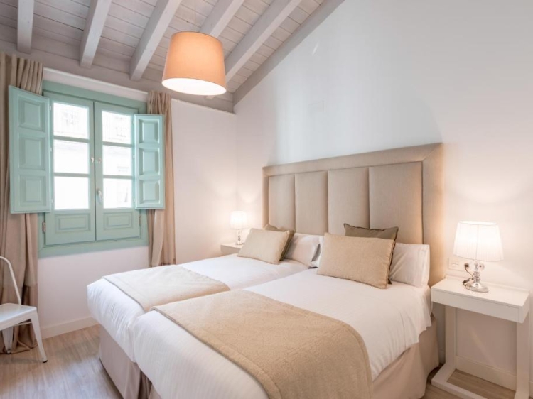A beautifully restored 19th-century palace in the heart of Granada, offering elegant self-catering boutique apartments — perfect for families or a romantic stay.