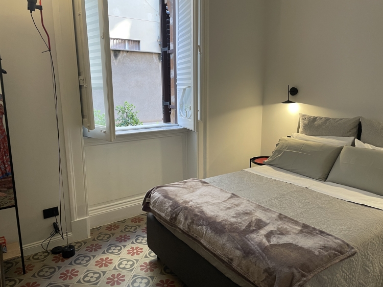 boutique apartment inside an Art Nouveau palazzo in Palermo. With original flooring, private patio and considered design, it sits in the elegant Libertà district, just 15 minutes on foot from the historic centre. A discreet urban base with character.