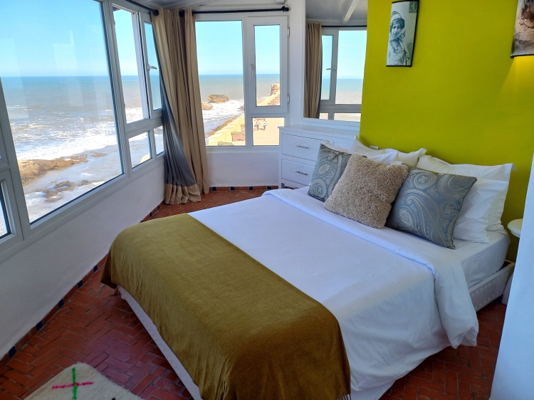 Spacious bedroom of flat no.3 in front of a great sea scenery.