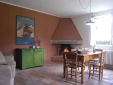 A fireplace is a plus, both for cooking and for enjoying a cozy atmosphere. (Brentina Est, kitchen)