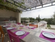 Outdoor eating by the pool with fully equipped kitchen