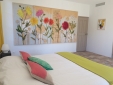Room 1, with a small sitting area and a private balcony. 180 x 200 cm bed (high quality bedding).  Bathroom with a large walk-in shower. Air-conditioned room, Internet access.